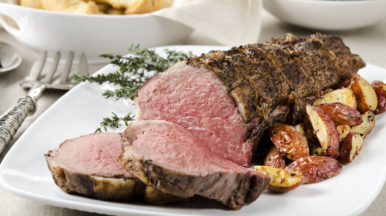 Sliced beef tenderloin with potatoes