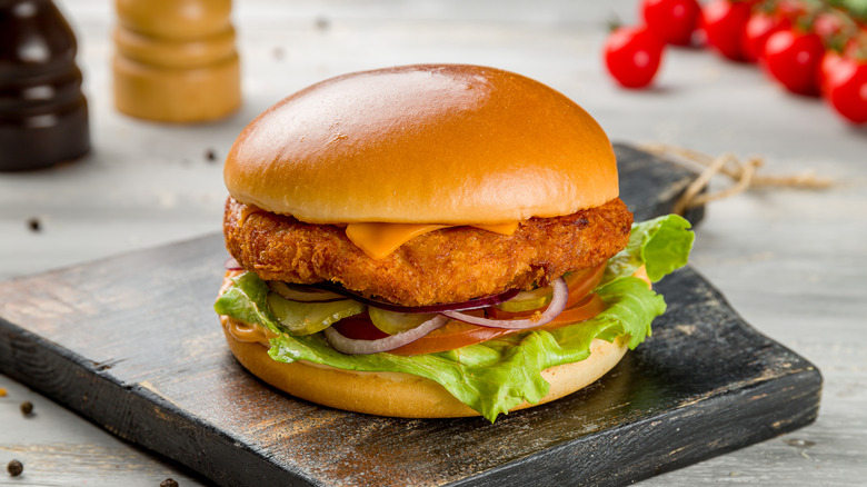Chicken sandwich on cutting board