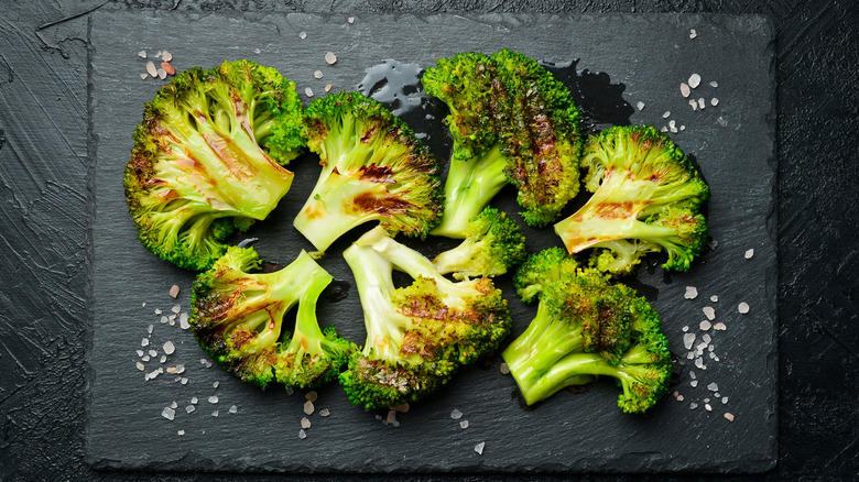 Roasted broccoli on dark background