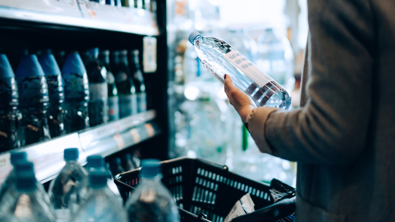A woman shops for bottled water