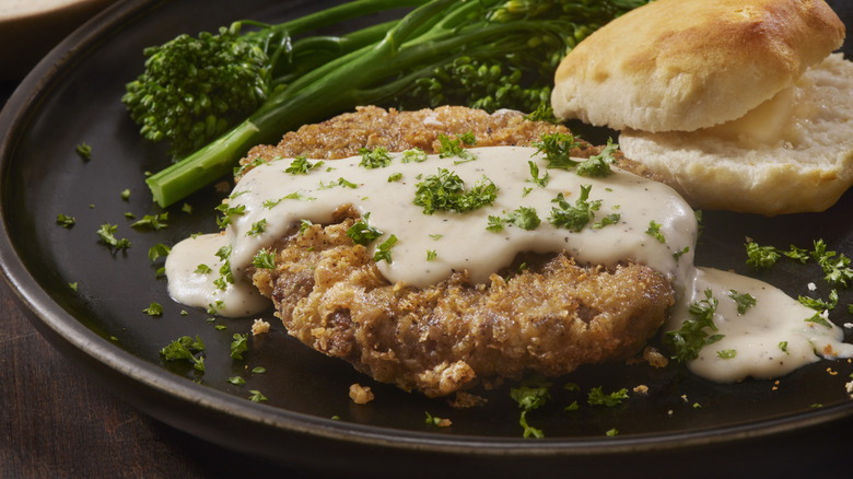 Chicken fried steak with biscuit