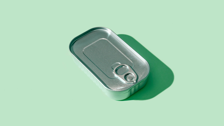 tuna can on a green background