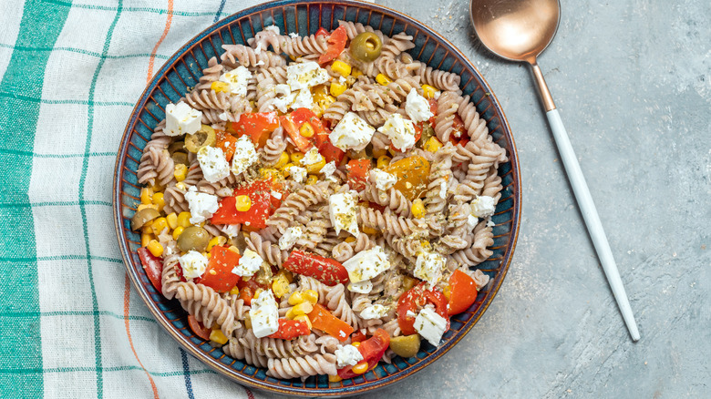 A bowl of pasta salad.