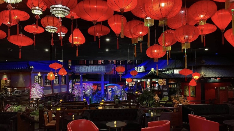 View inside Westgate Benihana, showing the brook, a torii gate, red lanters, and other Japanese-inspired touches.