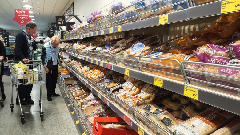 People perusing the bakery section in an Aldi supermarket