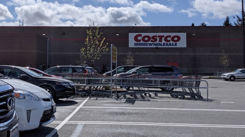 The exterior of the Costco wholesale club in Shoreline, Washington state with part of the parking lot visible.