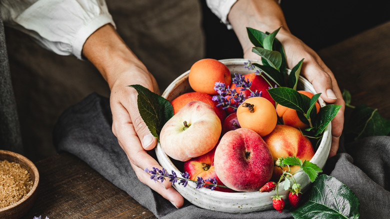 Bowl of fruit with peaches and apricots