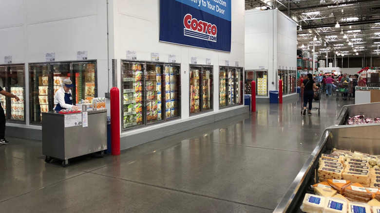 Ends of Costco frozen food aisles with free samples set up on one side