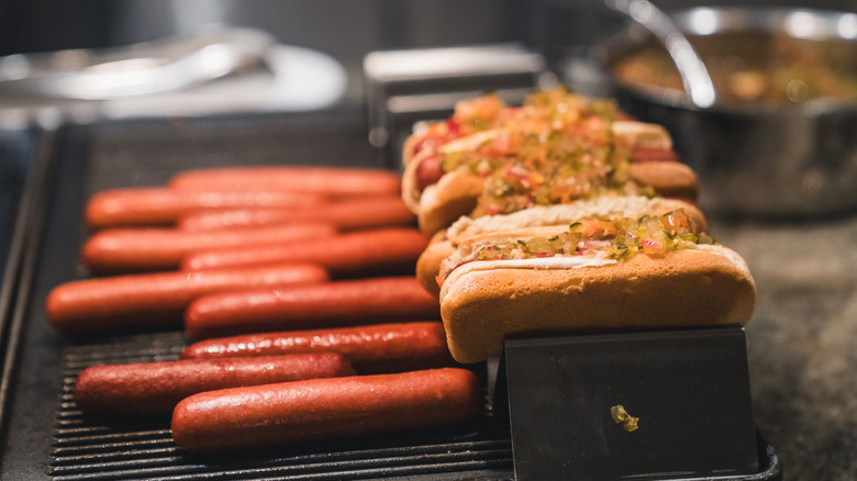 hot dogs on a grill