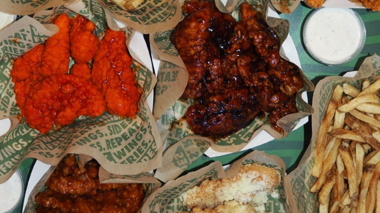 Wingstop wings and fries with sauces