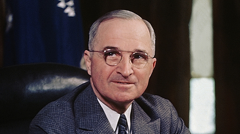 A photo of Harry S. Truman wearing a suit