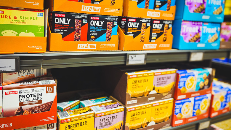 Boxes of goods line Aldi shelves.