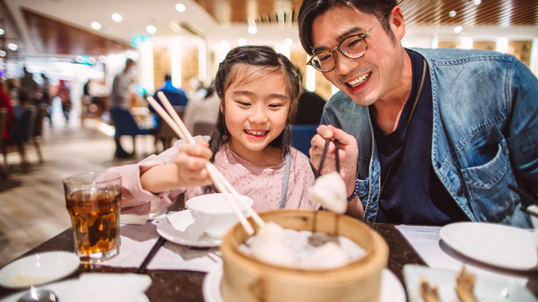 A father and daughter enjoying dim sum