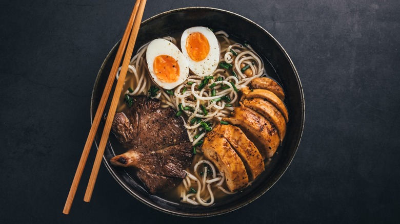 A bowl of ramen with toppings
