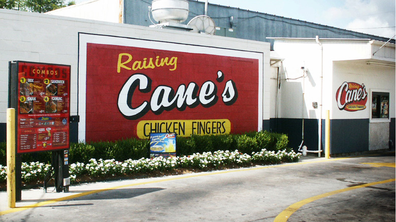 Exterior Raising Cane's restaurant and drive-through