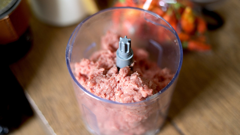 Ground beef in the bowl of a food processor