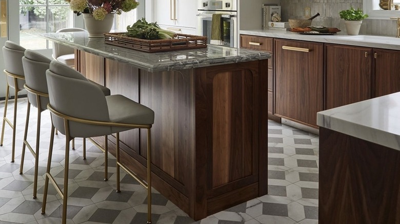 Kitchen with mixed-material counters and chairs