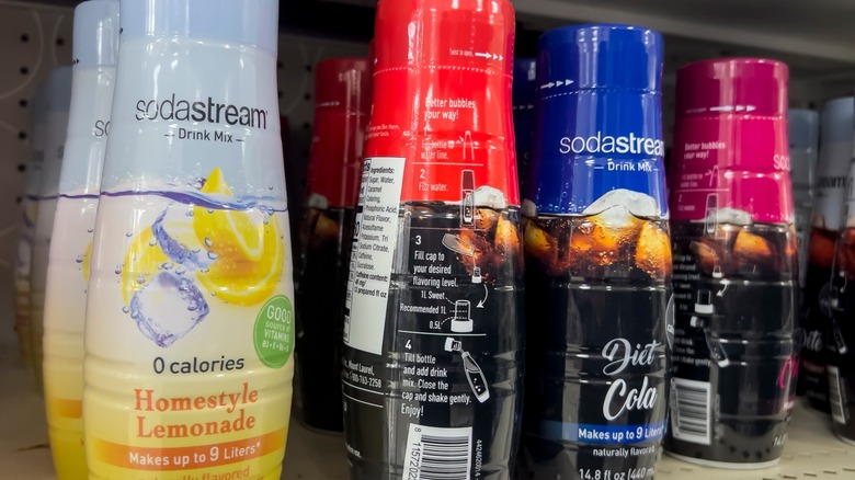Bottles of SodaStream syrups on a store shelf