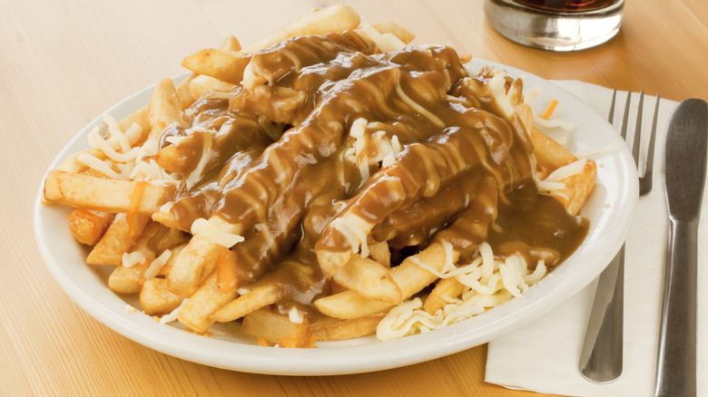 Plate of fries with gravy and cheese.