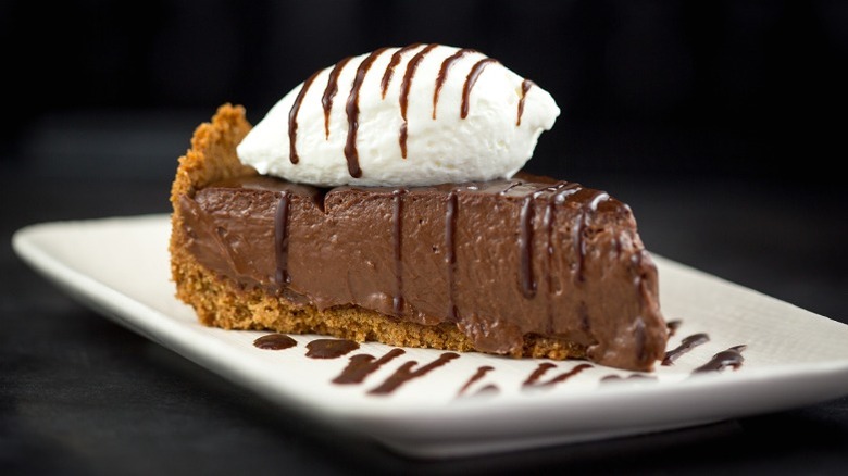 Slice of chocolate cream pie with drizzled chocolate