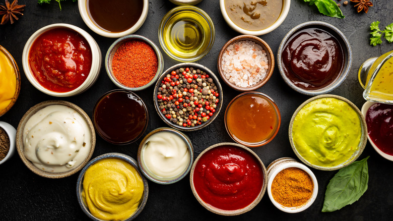 A variety of different dips and sauces in small bowls