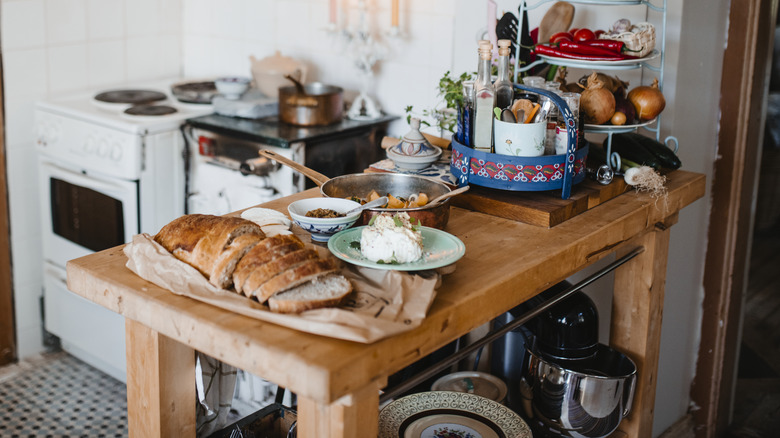 wooden table used as a mobile kitchen island