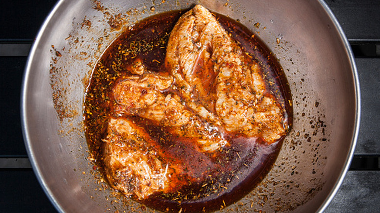Marinating chicken in a metal bowl