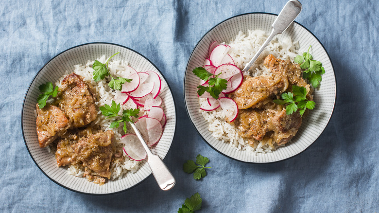 Slow cooker pork tenderloin served with white rice and sliced radishes