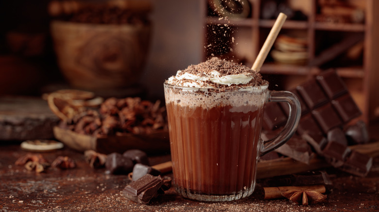 glass mug of hot chocolate with whipped cream