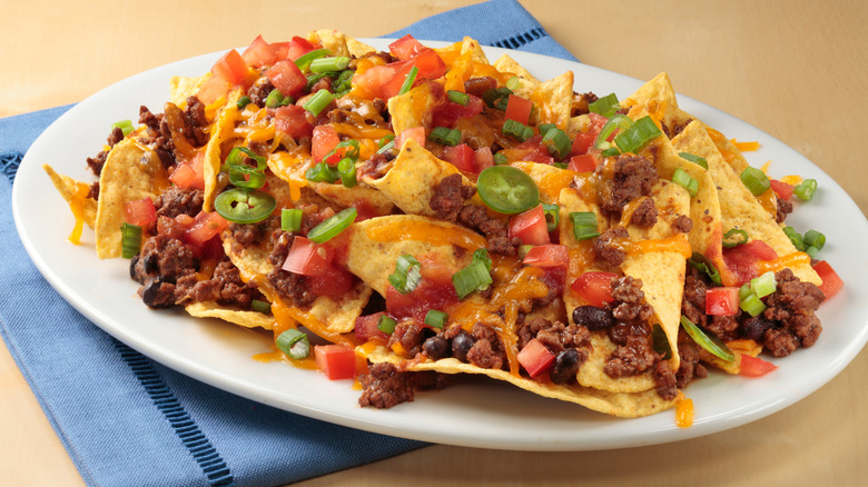 ceramic plate piled with nachos
