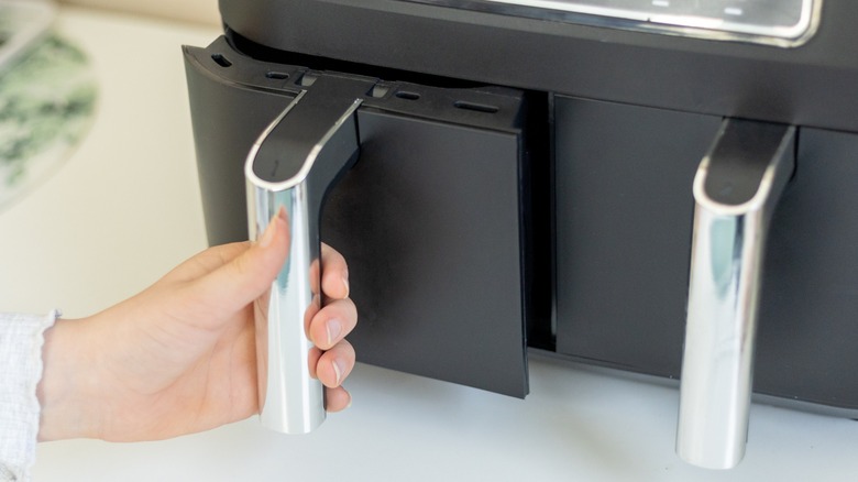 Black oil-free air fryer on kitchen counter top