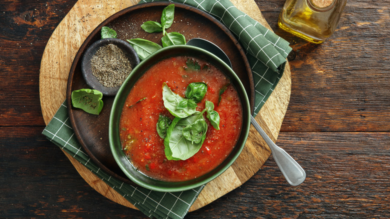 Tomato soup with green veggies.