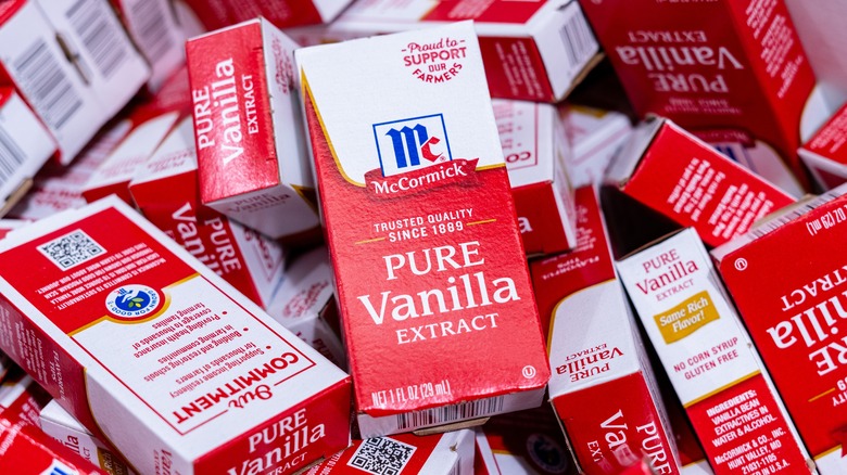 A grocery store bin of boxes of McCormick Pure Vanilla Extract.