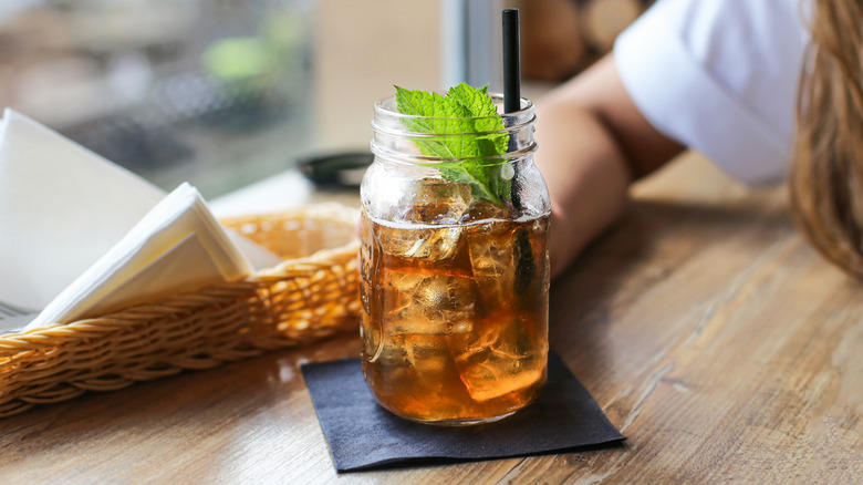 Cocktail napkin with a drink and a straw