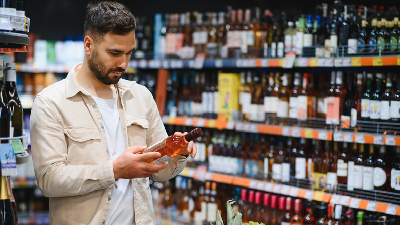 Person buying alcohol at a liquor store