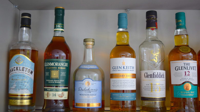 Whiskey bottle collection on shelf