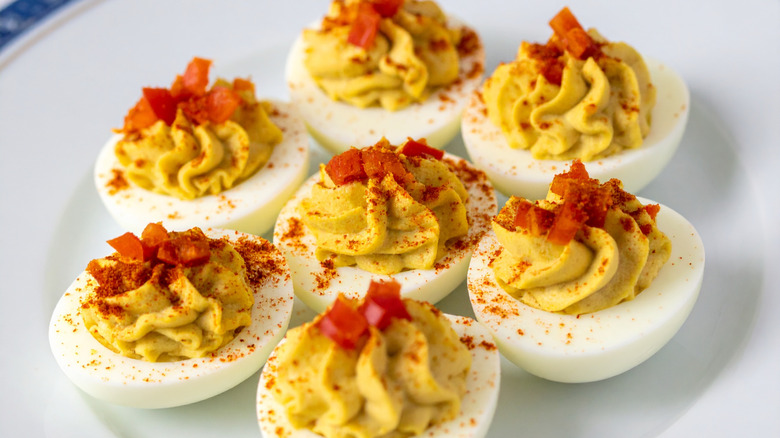 Deviled eggs on a white plate