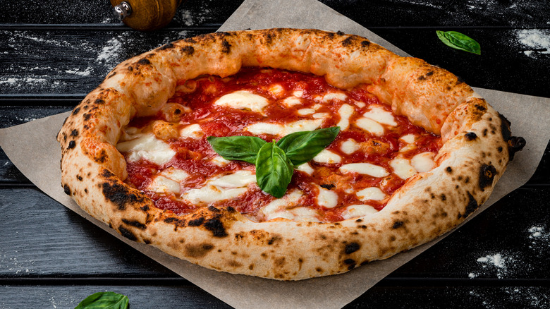 Margherita pizza on parchment paper