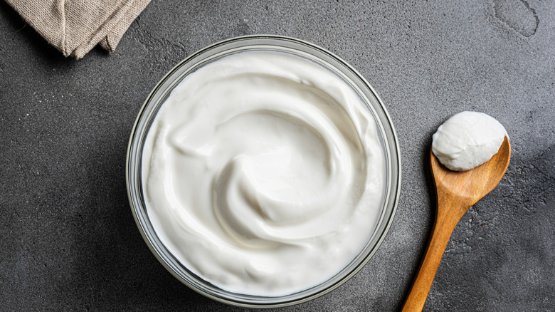 homemade yogurt dip next to a wooden spoon