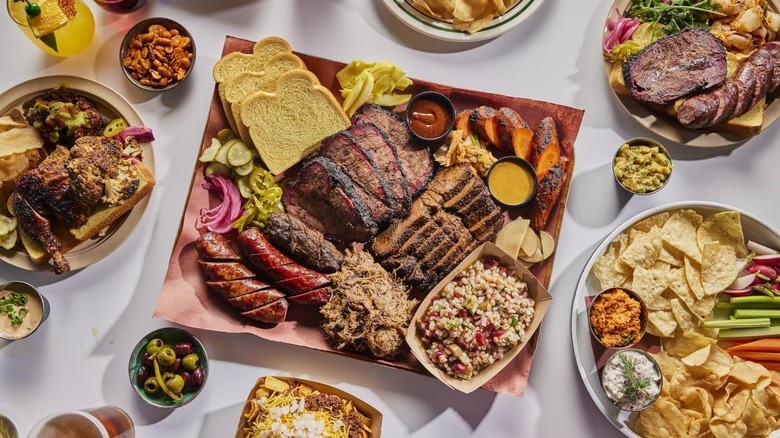 Platter of barbecued meats and sides on butcher paper