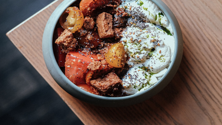 Bowl of beef stew and tomatoes