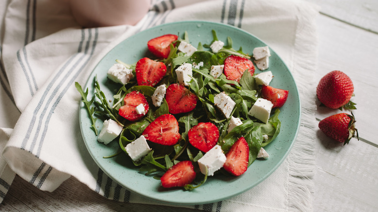 a simple salad with strawberries and feta