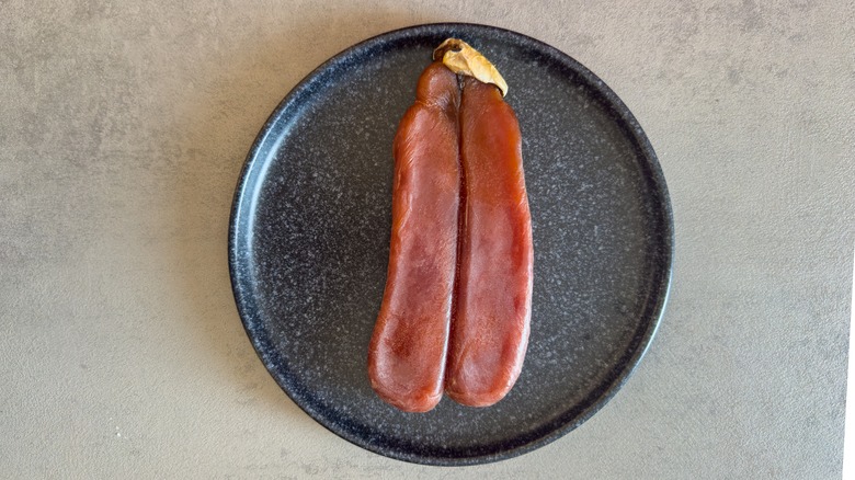 Bottarga on black plate