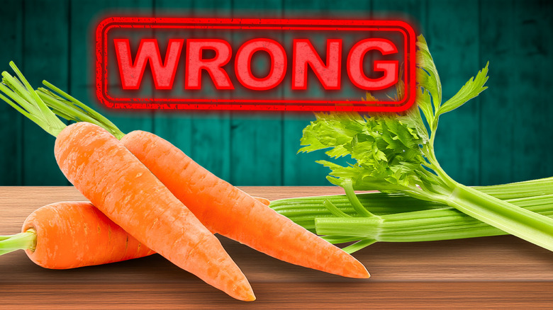 Sticks of carrots and celery on a table with "wrong" in upper third