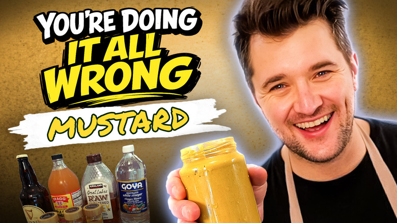 Man in apron holds jar of homemade mustard with ingredients and the video's title "You're Doing It All Wrong: Mustard" in the background.