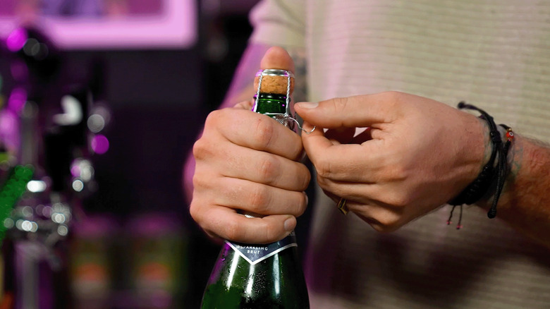 opening champagne bottle