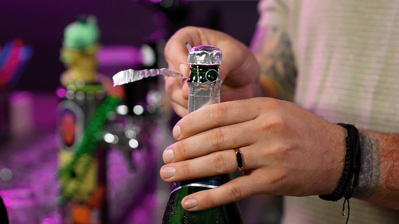 opening champagne bottle