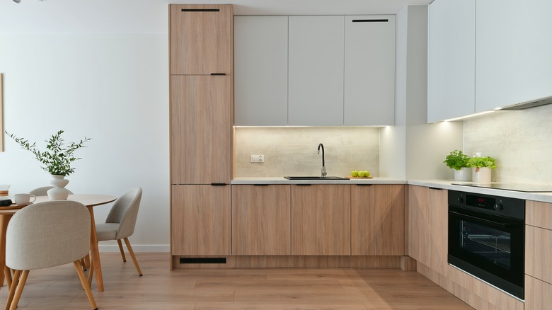 A kitchen with a dining table in the corner