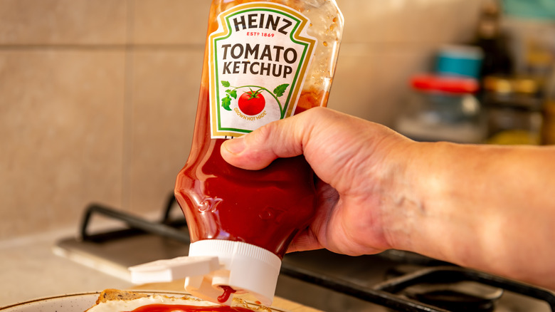 A close-up of a Heinz Tomato Ketchup bottle.