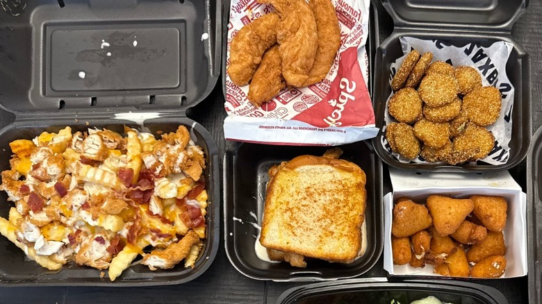 Several Zaxby's food items on a black table